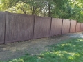 Walnut wood grain vinyl maintenance free fence