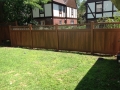 Vinyl wood grain fence with bronze aluminum spindle top combination maintenance free fenceBronxville NY